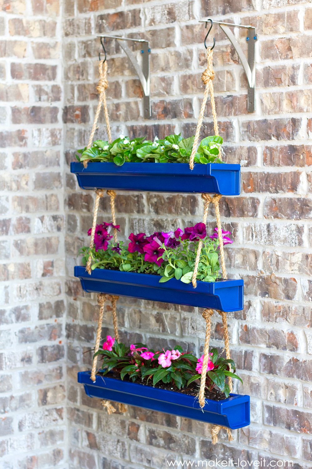 DIY Hanging Rain Gutter Planters | via Make It and Love It